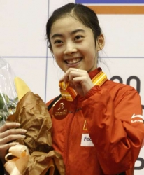 Photo of Wang Shixian with medal.