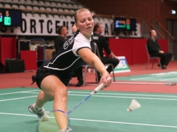 Anu Nieminen returning a badminton drop shot with grace.